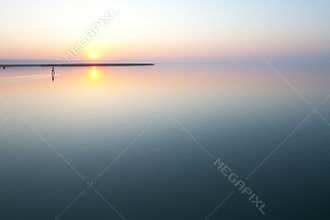 Sunset over calm lake