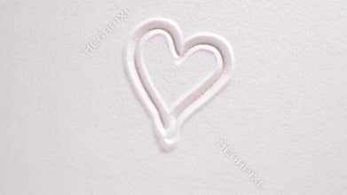 Japanese zen garden with heart in textured sand