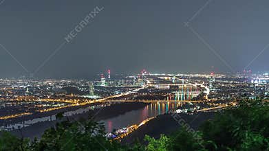 Skyline of Vienna from Danube Viewpoint Leopoldsberg aerial night timelapse.