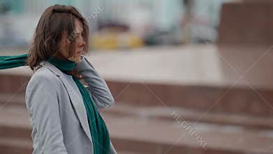 lonely middle aged woman is walking on city streets, bad mood, desperation and sadness