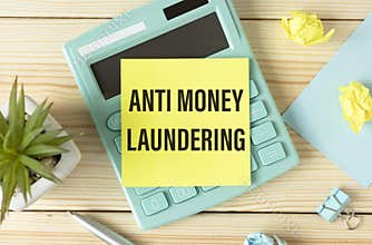 AML Anti Money Laundering. text on white paper