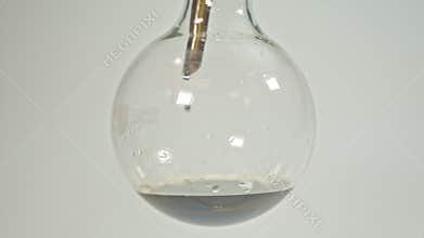 Swing a glass jar to boil cannabis.