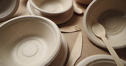 Eco-friendly disposable tableware. recycled paper dishes and wooden cutlery