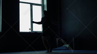 Soft focus Man jumping rope in the gym. Silhouette of an athlete.