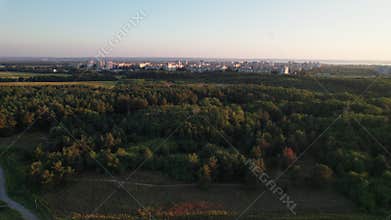 Aerial view Small Town with High-Rise Buildings Surrounded by Green Vegetation