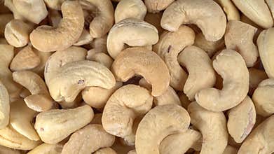 Many cashew nuts at rotating background