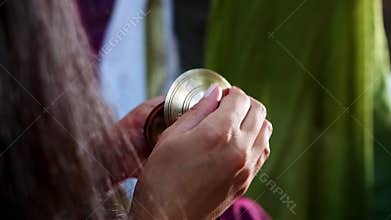 Puja worship of God. Women's hands play the bells