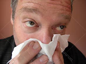 Men blowing his nose #1