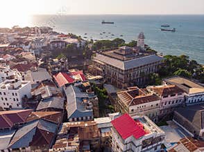 Above the Building Roofs Aerial view of Zanzibar, Stone Town. Tanzania. Sunset Time Coastal City in Africa