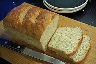 Home-baked English muffin toasting bread, sliced and ready for breakfast