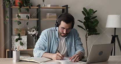 Man studying with online tutor using laptop and videocall app