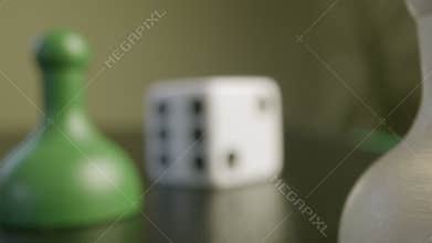 Close up pawns and die from board game. High quality