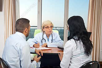 Doctor give medical advices to couple