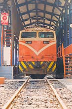 Taiwan Railway Administration TRA E327 Electric locomotive train at railway station. building Asia, design architecture