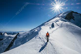 Before Mont Blanc Monte Bianco summit 4808m last ascending. Team roping up Man with climbing axe dressed high altitude