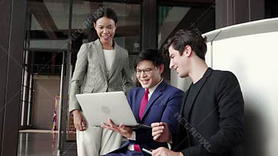 Group team business man and woman meeting and discussing using laptop computer while success with high five.