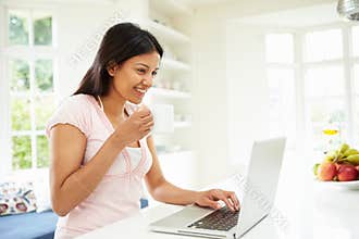 Indian Woman Using Laptop At Home