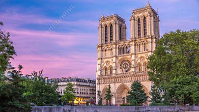 Front view of Notre Dame De Paris cathedral day to night timelapse after sunset.