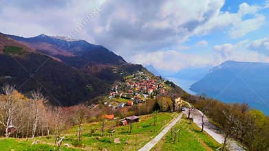 Panorama of Bre village against the Alps and blue sky, Ticino, Switzerland