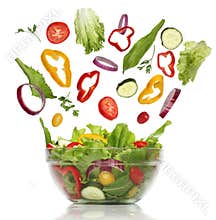 Falling fresh vegetables. Healthy salad