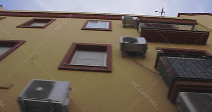 Building facades architecture with windows and white walls on the street