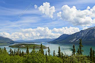 Bove Island and Tagish Lake under big sky, along Klongdike highway