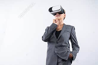 Smart businesswoman thinking about plan while wearing VR glasses. Contraption.