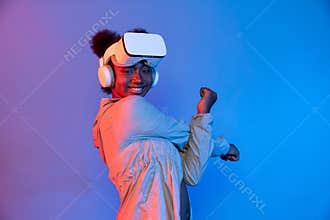 Young African sport woman wearing VR stretching whole body posing. Contrivance.