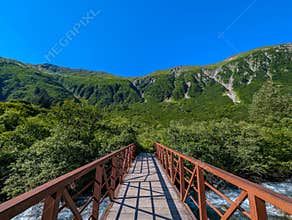 Beautiful scenery of the Preservance Trail with a wooden bridge