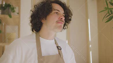 Portrait of a guy waiter, tired from overwork. Portrait of frustrated man on work