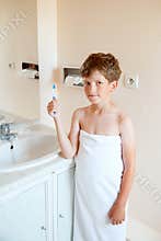 Boy with dental cleaning brush