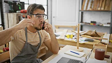Young hispanic man\'s open-mouthed disbelief, fear and amazement in carpentry workshop, portrait of scared guy, surprised