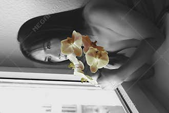 Asian woman by the window