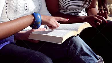 Friends Reading Bible on the Beach