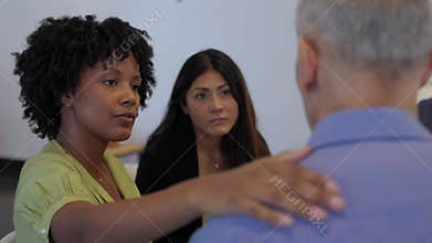 Diverse group of people in therapy session at community center
