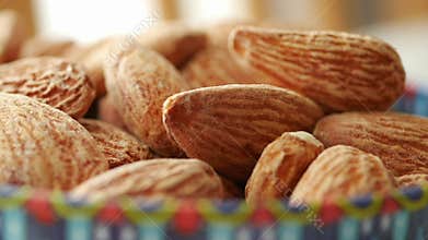 Enjoying fresh almonds in a colorful bowl at home