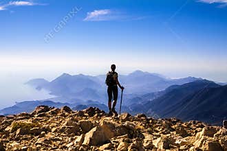 Tourist woman on the top of mount,