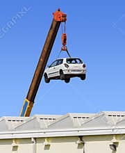 Car Hanging by the Arm of a Crane