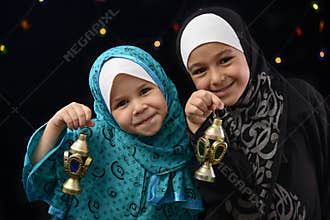 Happy Muslim Girls with Ramadan Lantern