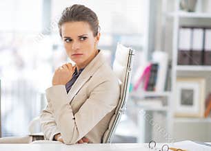 Portrait of concerned business woman in office