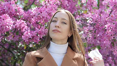 A young girl takes off a protective mask, end of coronavirus pandemic