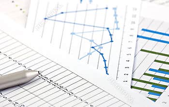 Financial charts and graphs on the table