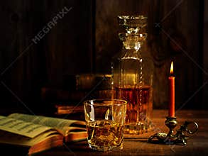 Scotch Whisky Ice with Burning Candle Old Book