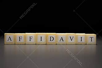 The word AFFIDAVIT written on wooden cubes isolated on a black background