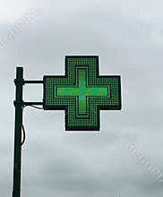 European green cross pharmacy store sign: Farmacia. Pharmacy sign.