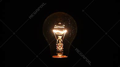 Electric lightbulb increasing in brightness