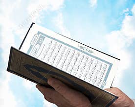 Muslim Hands Holding Quran