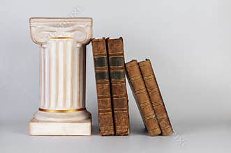 Ancient Greek column and old books.