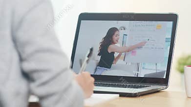 Young Asia teen girl university student using laptop computer distance learn lesson with female teacher remote teaching.