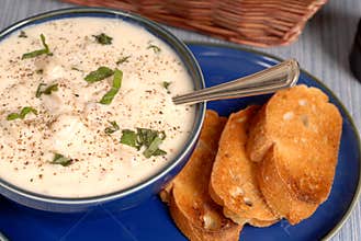 Overhead view of New England Chowder in a blue bowl